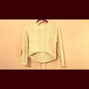 A beige sweater crop top